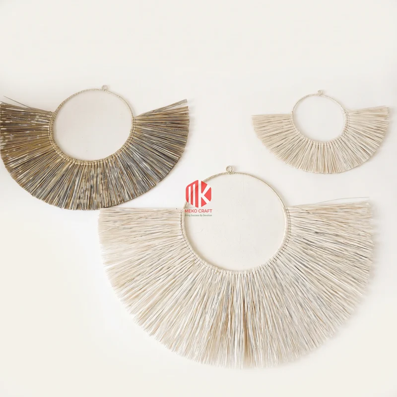 Handwoven Palm Leaf Fan Wall Decor Set of 3 9 Studio shot of three fan-shaped wall hangings made of natural palm leaf strips on a pure white background.