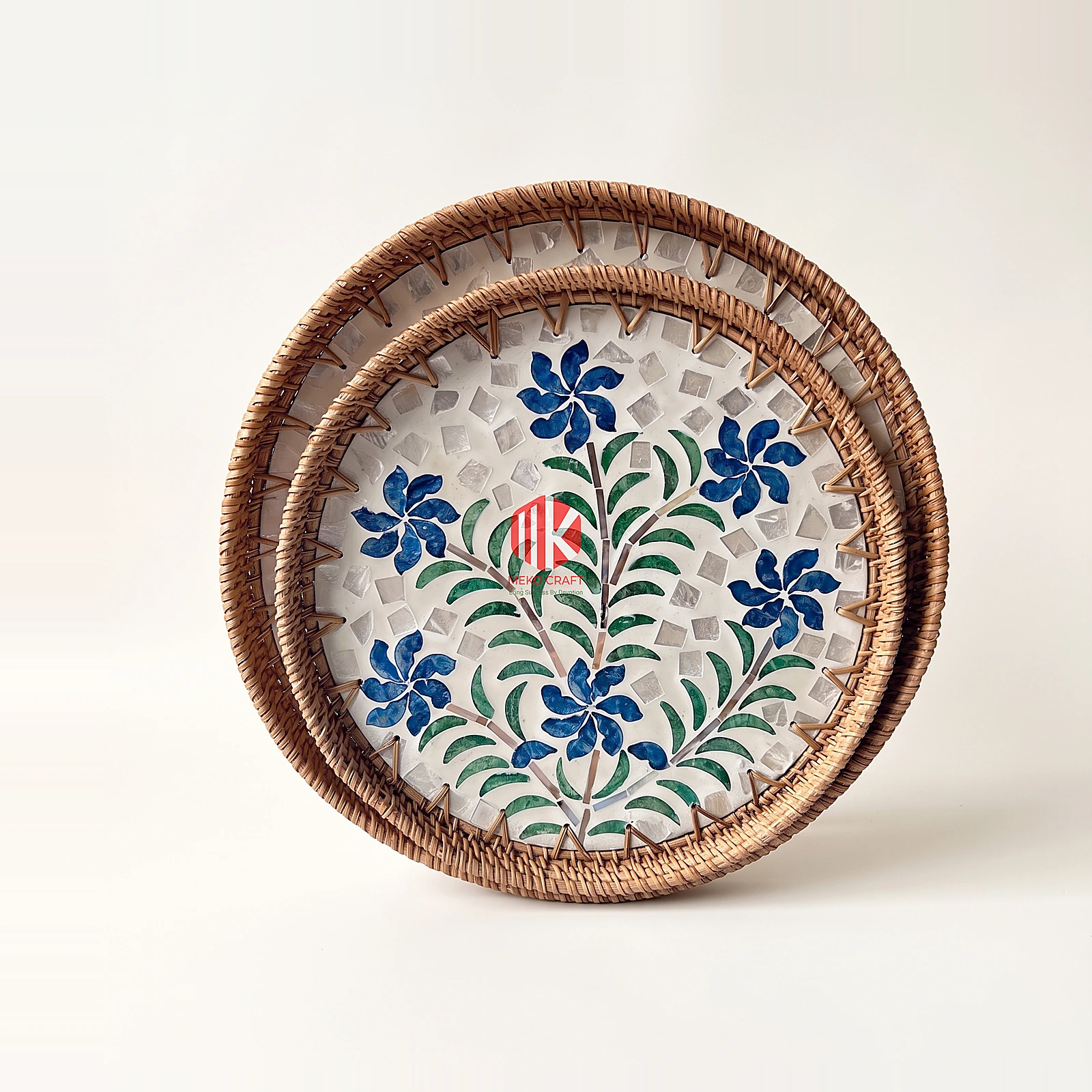Blue Floral Mother of Pearl Round Tray Set 4 Two round trays featuring blue floral mosaic bases and rattan rims, shown from an overhead angle on a white background.