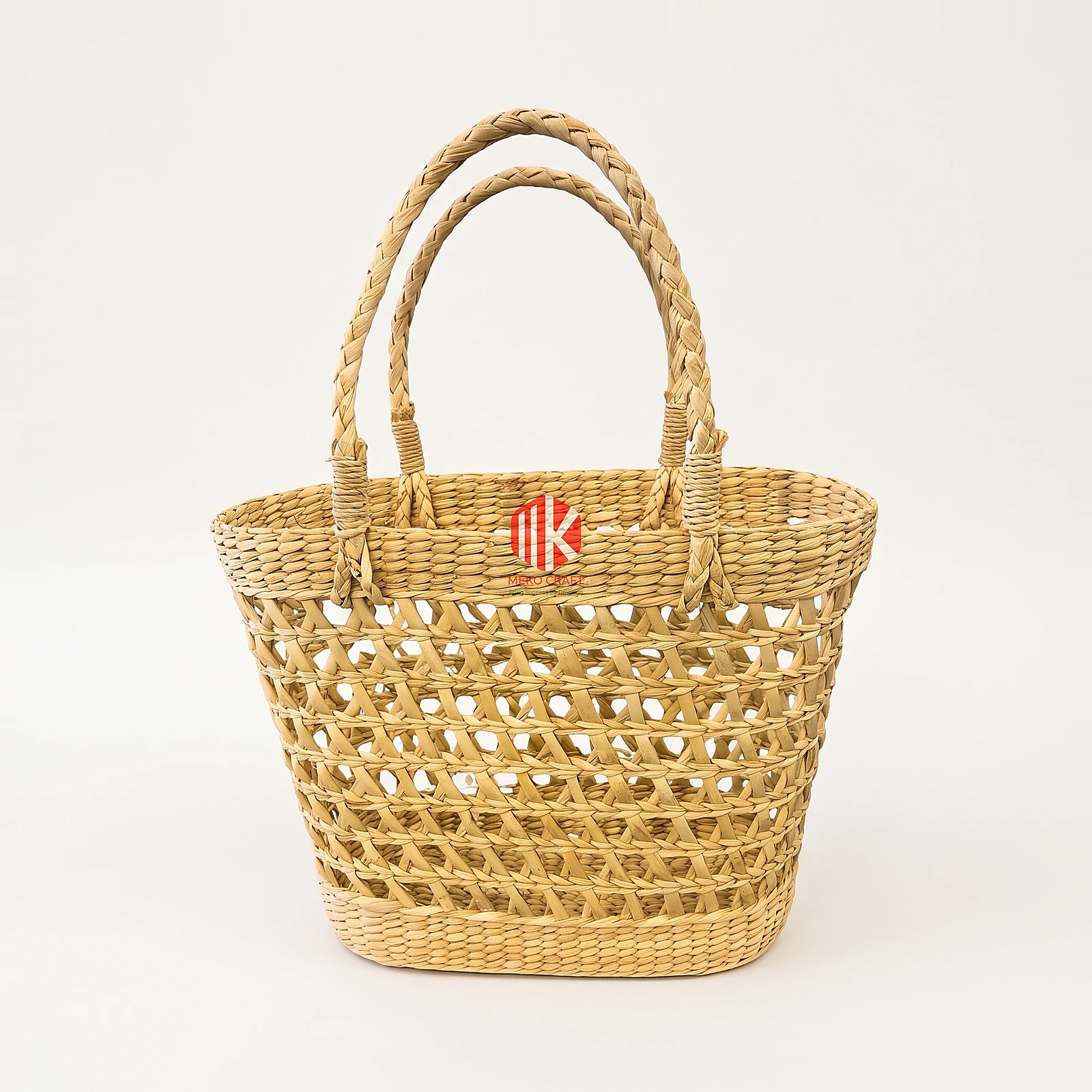 Lattice Woven Water Hyacinth Handbag with Braided Handles 4 Studio shot of a handwoven water hyacinth handbag showing the hexagonal weave pattern and braided handles against a white background.