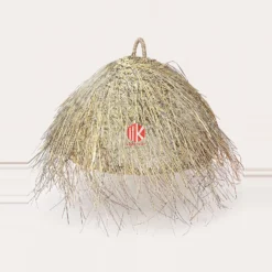 A studio shot of a tapered palm leaf lampshade with a thick shaggy fringe and a top loop handle on a white background.