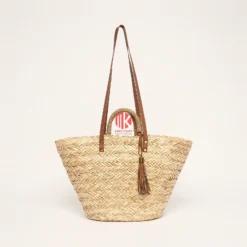 Handwoven Twill Palm Leaf Handbag with Tassel 5 Studio shot of a handwoven palm leaf handbag with brown straps and a tassel, showing the tight twill weave against a white background.