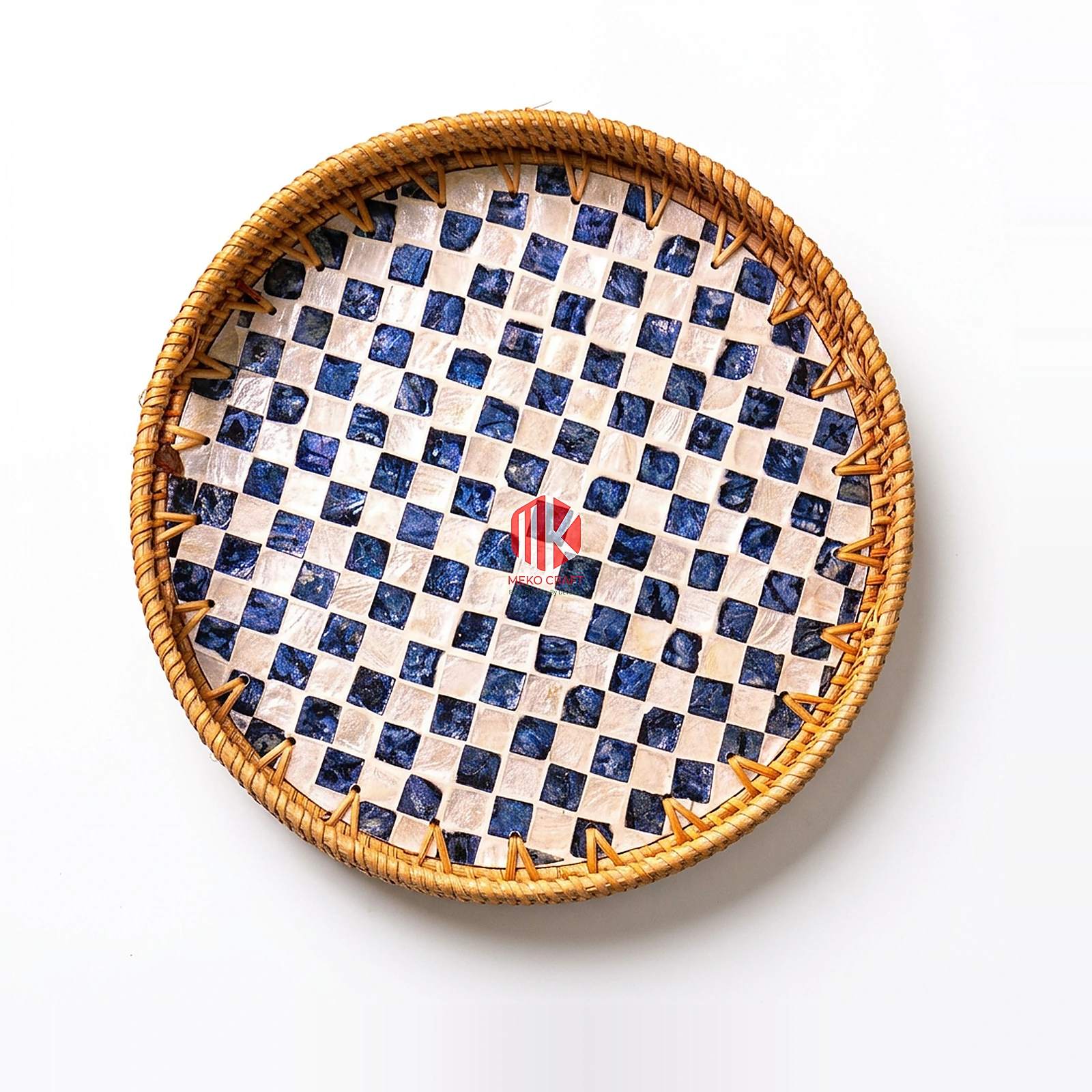 Checkerboard Rattan and Mother of Pearl Round Serving Tray 2 Overhead studio shot of a round serving tray with a woven rattan rim and a checkerboard pattern of white mother of pearl and blue squares on a white background.
