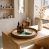 Handcrafted round mother of pearl tray with green mosaic center displayed on a boutique retail wooden table with perfume bottles.