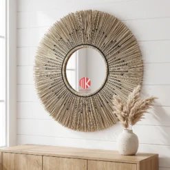 seagrass place mat 13 Round sunburst palm leaf and seagrass fringe wall mirror on a white shiplap wall in a coastal living room above a light oak