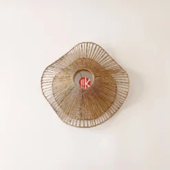 Meko Craft - Vietnam Handicraft Factory 10 Top-down view of a wavy seagrass lampshade showing the concentric metal frame and twisted rope weaving.